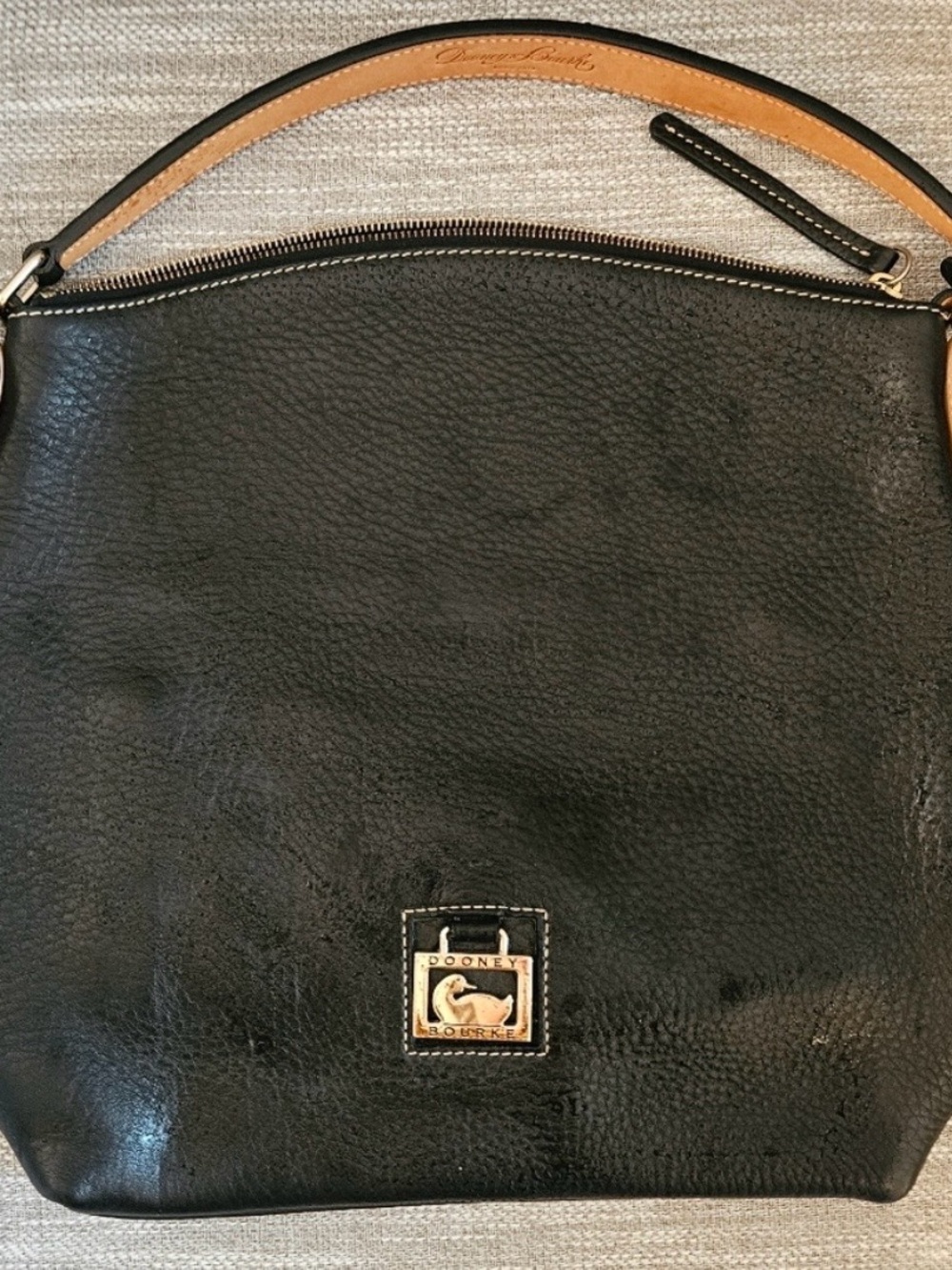 Dooney & Bourke Black and Tan Hobo Bag with Gold Hardware